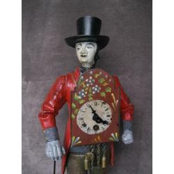 Vintage klokkenventer met klokje op buik